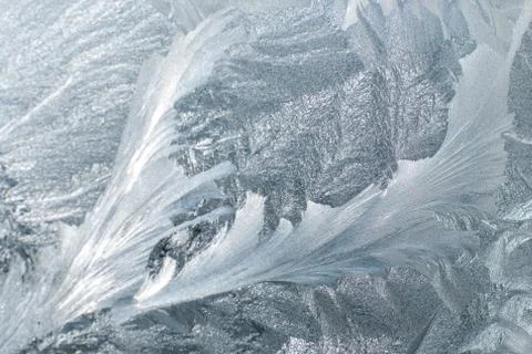Frosty patterns on glass in winter Stock Photos