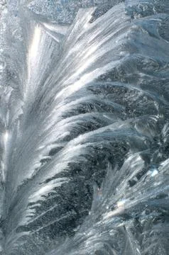 Frosty patterns on glass in winter Stock Photos
