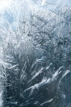 Frosty patterns on glass in winter Stock Photos