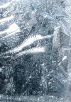 Frosty patterns on glass in winter Stock Photos