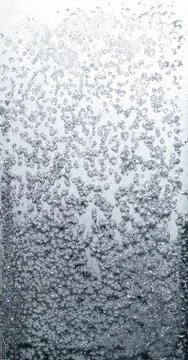 Frosty patterns on glass in winter Stock Photos