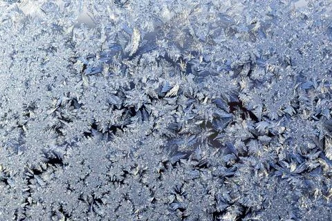 Frosty patterns on the window frosty background Ice on a window 스톡 사진