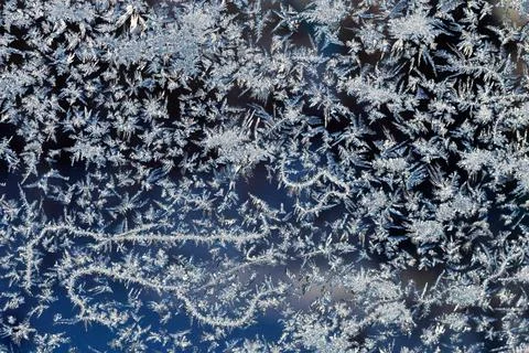 Frosty patterns on the window frosty background Ice on a window Fotos Stock