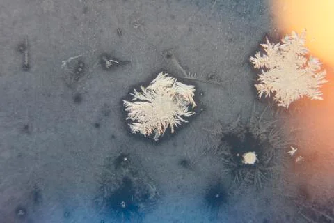 Frosty patterns on the window. place under the text. Stock Photos