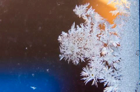 Frosty patterns on the window. place under the text. Stock Photos