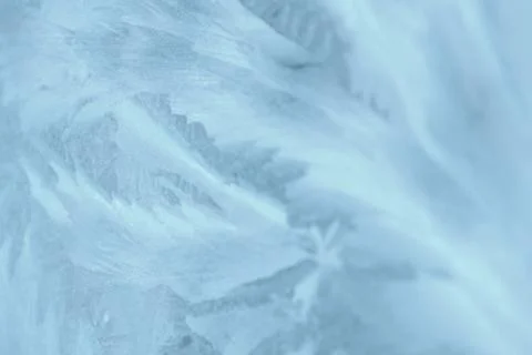 Frosty patterns on the window in winter. Natural abstract background Stock Photos