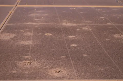 Frosty solar panel surface in winter showing hail storm damage and deterior.. Stock Photos
