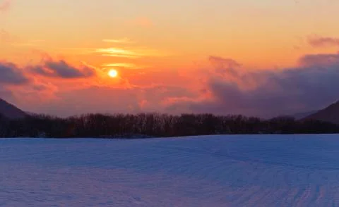 Frosty sunset in the mountains in winter Stock Photos