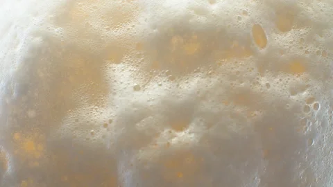 Froth on the surface of beer Stock Footage 135363653