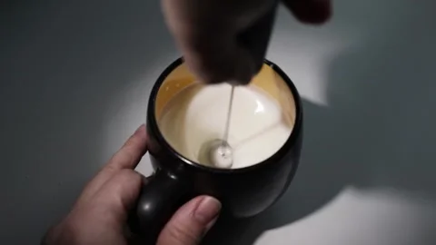 Frothing milk for espresso, coffee maker in action, perfect foamy cup Stock Footage 267092490