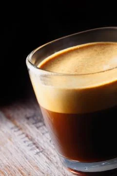 Frothy aromatic mug of fresh coffee Stock Photos