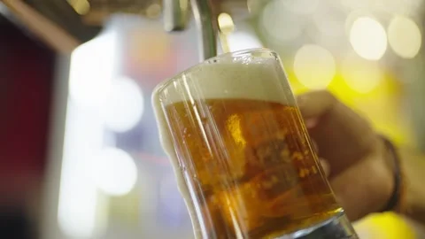 Frothy Beer Poured at a Bar Counter Stock Footage 308589664