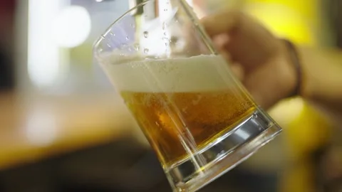 Frothy Beer Poured at a Bar Counter Stock Footage 308589715