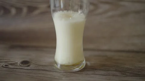 Frothy Beer Poured at a Bar Counter Stock Footage 308589953