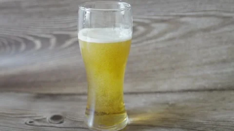 Frothy Beer Poured at a Bar Counter Stock Footage 308590012