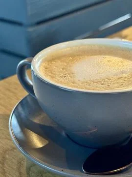 Frothy Coffee in a Ceramic Cup Foto stock