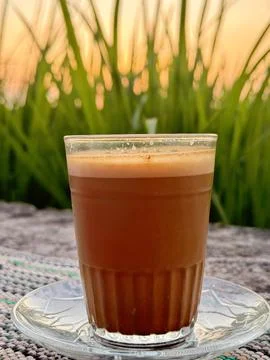 Frothy Coffee at Sunset Outdoors Stock Photos