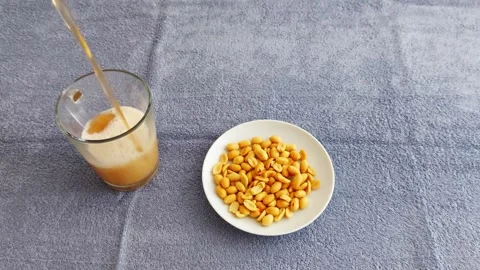 Frothy Drink Peanuts: A Crunchy Sip Combo Youll Crave Stock Footage 316878325