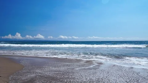Frothy Ocean Waves washing sandy beach Stock Footage 82806538