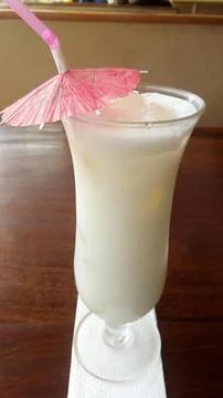 Frothy Pina Colada drink. Stock Photos