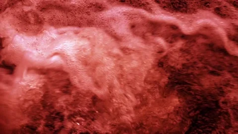 A frothy scarlet liquid Stock Footage 143349463