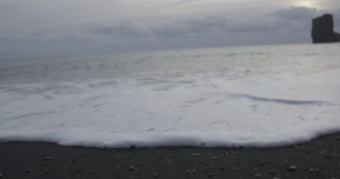 Frothy sea waves on the coast at dusk Stock Footage 103808187