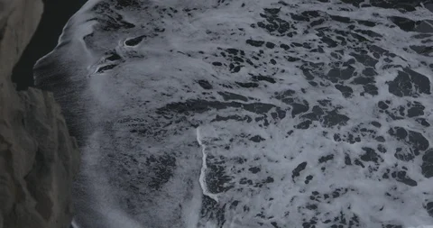 Frothy sea waves reaching the coast Stock-Footage 103807791