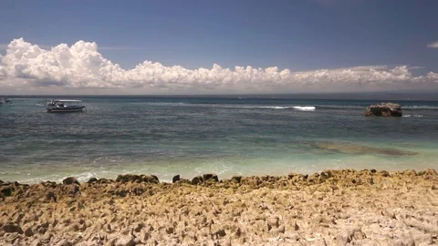 Frothy waves of ocean crash against rocky shore Stock Footage 108791996