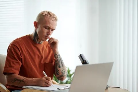 Frowning Blogger Checking Script Stock Photos