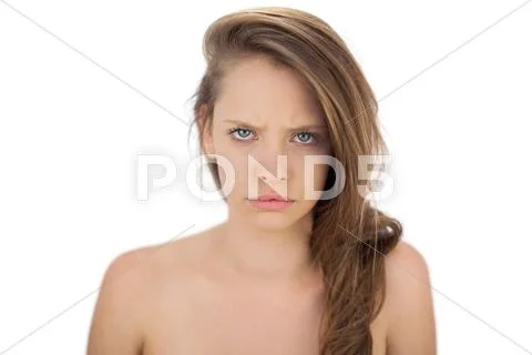 Frowning brunette model looking at camera Stock Photos