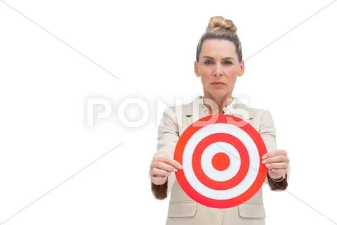 Frowning businesswoman holding target Stock Photos