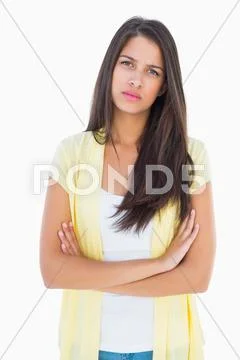 Frowning casual woman looking at camera Stock Photos