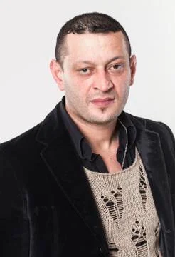 Frowning man looking at camera Stock Photos