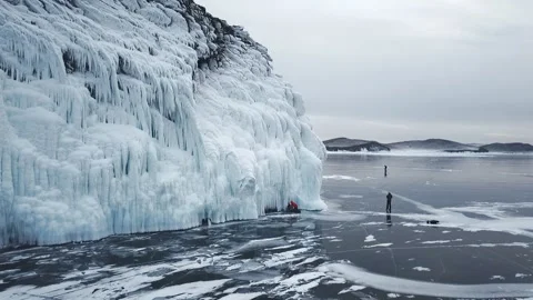 Frozen after winter storms, water splashes on the cliffs of the shore. Baikal. Stock Footage 107898758