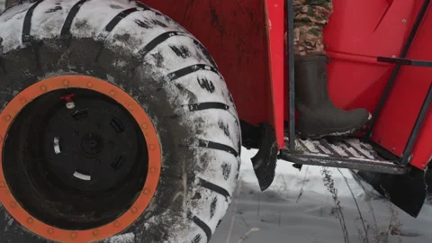 Frozen ATV tire with snow. Closeup of ATV tire covered in snow and mud. Detailed Stock Footage 332045988