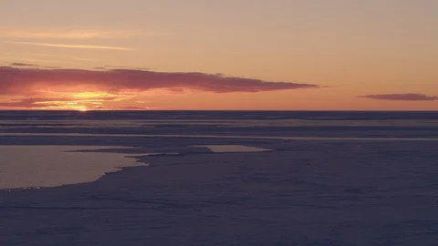 Frozen Baltic Sea at sunset Stock Footage 128960640