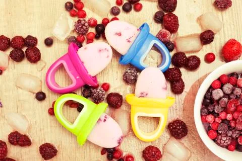 Frozen berry Popsicles for babies Stock Photos