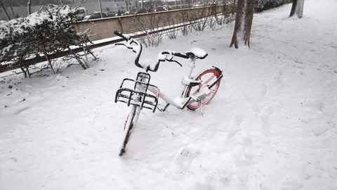 Frozen bicycle near the Eiffel Tower in winter with snow in Paris France Stock Footage 106521181