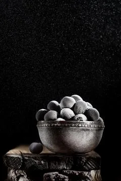 Frozen blue berry on a dark background Stock Photos