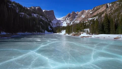 Frozen blue ice cracks Dream Lake Colorado RMNP Emerald Lake Rocky Mountain Stock Footage 333479754