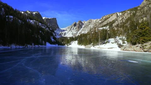 Frozen blue ice shade Dream Lake Colorado RMNP Emerald Lake Rocky Mountain Stock Footage 333854529