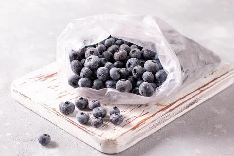 Frozen blueberries in a plastic bag. Frozen berries Stock Photos