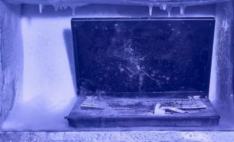 Frozen broken laptop computer Foto stock