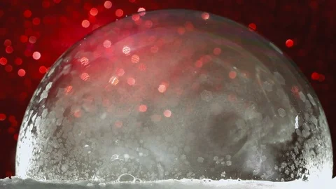 Frozen bubble with flying snowflakes, winter holidays background Stock Footage 73046979