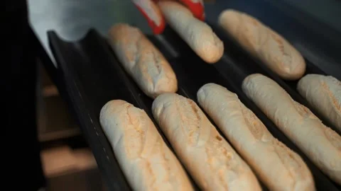 Frozen buns are placed on a tray to put them in the oven for baking Stock Footage 137121632