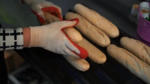 Frozen buns are placed on a tray to put them in the oven for baking Stock Footage 137121648