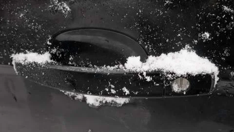 Frozen car handle in winter. Photos