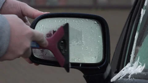 Frozen car mirror. Clean off the ice Stock Footage 143583198