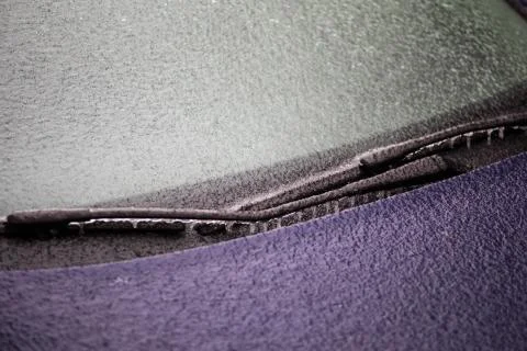 Frozen car wind screen with wipers Stock Photos