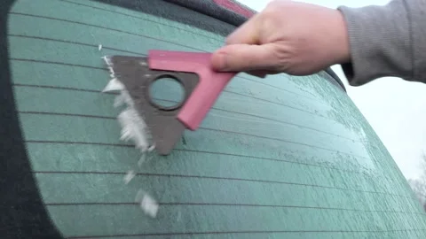 Frozen car windows. Clean off the ice Stock Footage 143583197